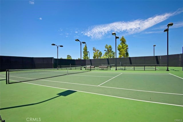 view of sport court featuring community basketball court and fence