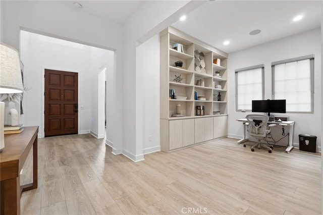 office space with recessed lighting, baseboards, and light wood-style flooring