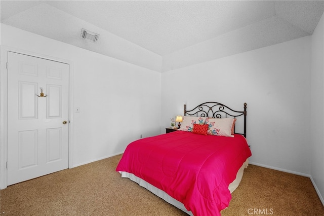 carpeted bedroom featuring visible vents, baseboards, a textured ceiling, and vaulted ceiling