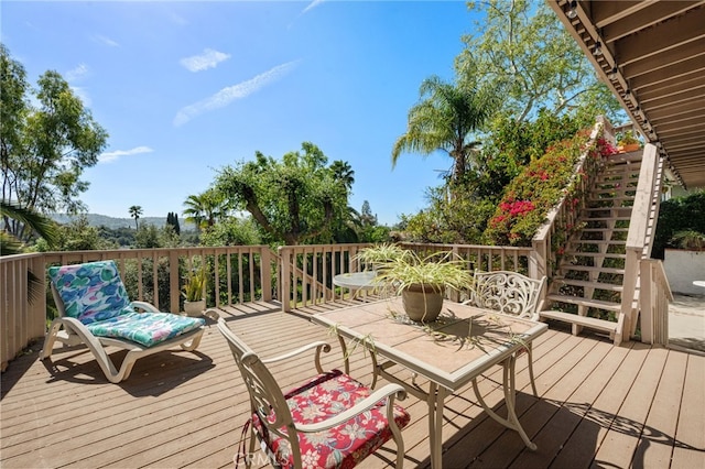 wooden deck with outdoor dining space