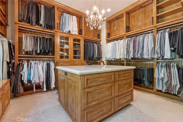 walk in closet featuring a notable chandelier