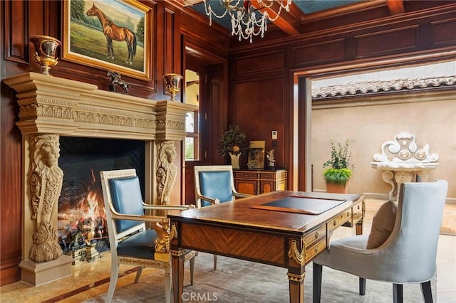 living area featuring coffered ceiling, beamed ceiling, crown molding, wood walls, and a chandelier