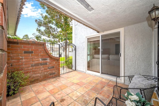 view of patio / terrace with a gate