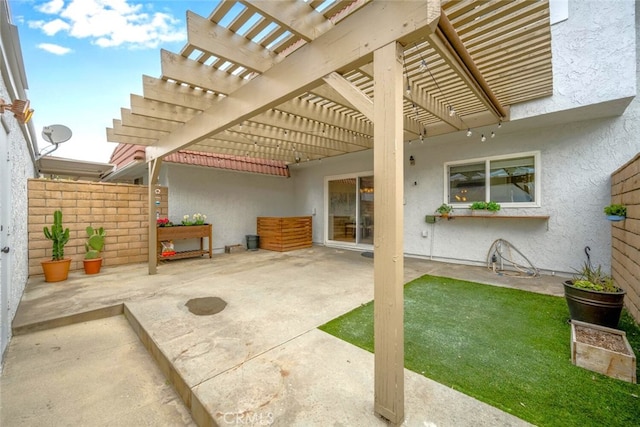 view of patio / terrace featuring fence and a pergola