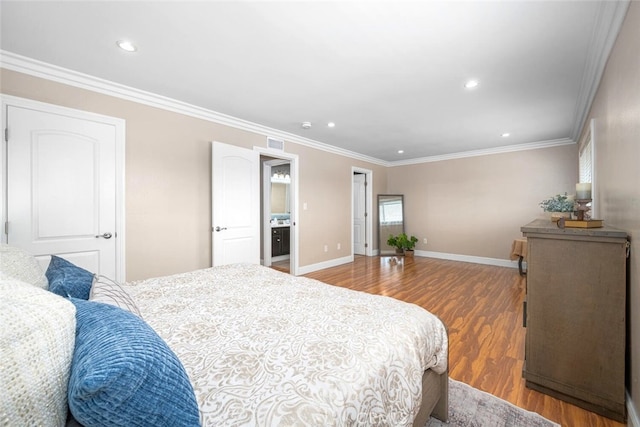 bedroom with wood finished floors, crown molding, visible vents, and recessed lighting