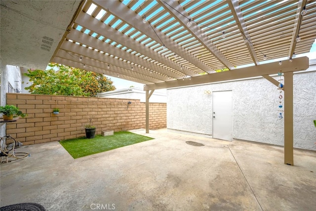 view of patio / terrace with a pergola and a fenced backyard
