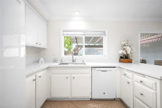 kitchen with light countertops, white dishwasher, white cabinets, a sink, and crown molding