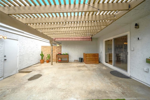view of patio featuring fence and a pergola