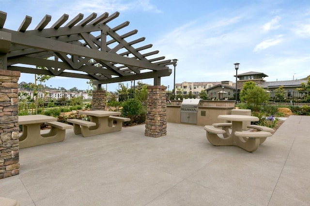 view of patio / terrace featuring fence, a pergola, and area for grilling