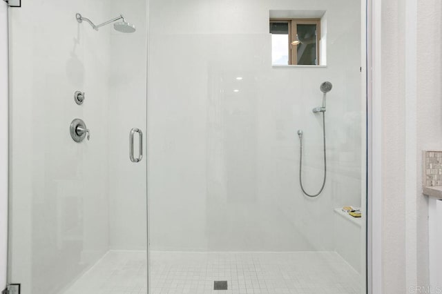 bathroom featuring a shower stall