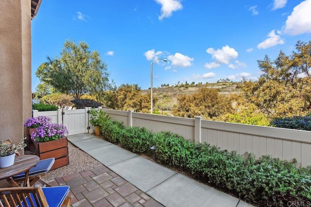 view of patio / terrace featuring a gate and fence