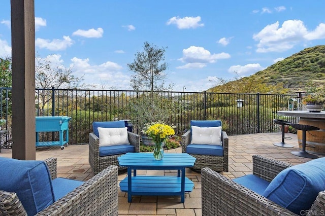 view of patio with fence and an outdoor living space