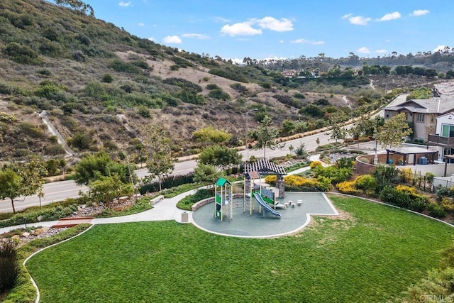 exterior space with playground community and a yard