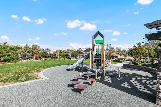 community play area featuring a yard