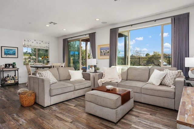 living room featuring recessed lighting, visible vents, and wood finished floors