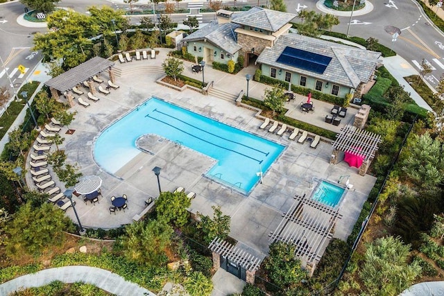 pool featuring a patio area and fence