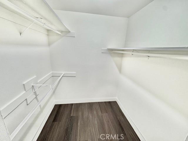 3601 W Hidden Ln Unit 309, Rolling Hills Estates, CA 90274 - walk in closet featuring dark wood-style floors