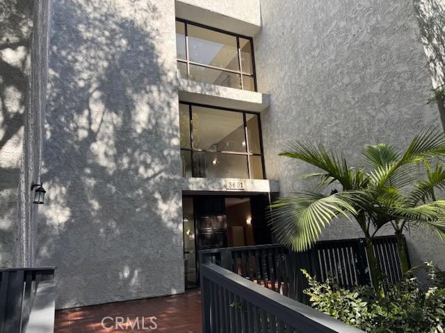 3601 W Hidden Ln Unit 309, Rolling Hills Estates, CA 90274 - rear view of property featuring stucco siding and a balcony
