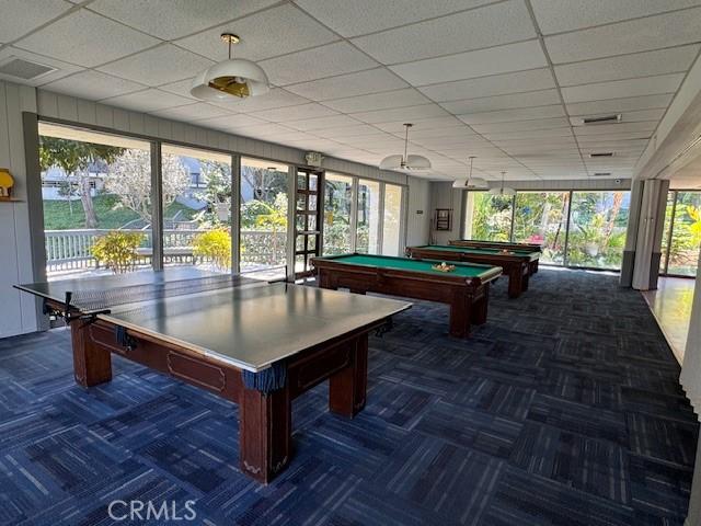 recreation room with a drop ceiling and billiards