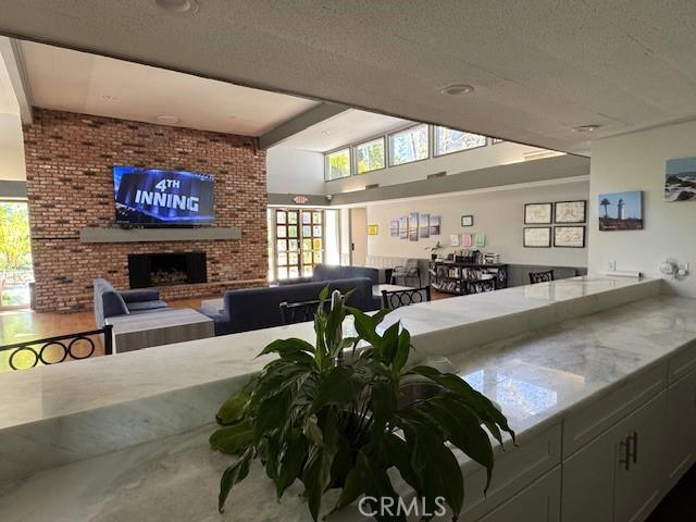 3601 W Hidden Ln Unit 309, Rolling Hills Estates, CA 90274 - living area with a brick fireplace