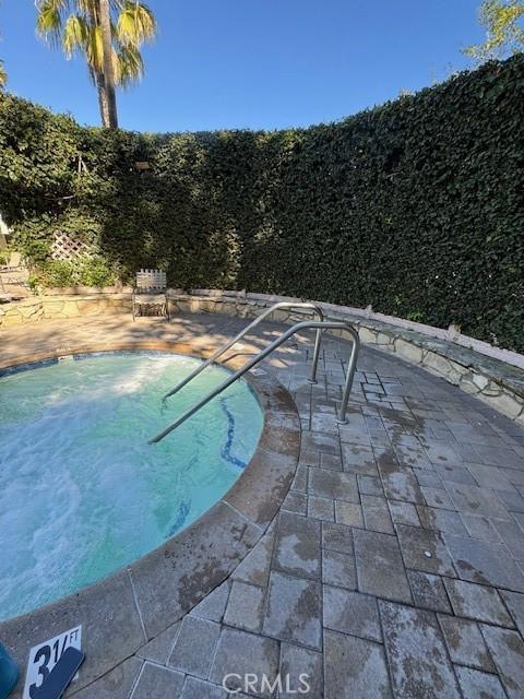 view of pool featuring a patio