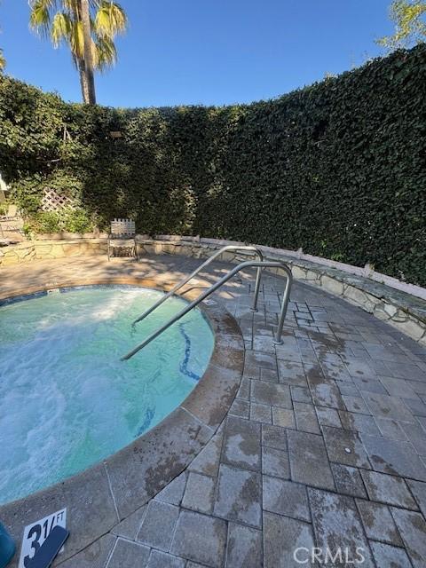 3601 W Hidden Ln Unit 309, Rolling Hills Estates, CA 90274 - view of swimming pool featuring a swimming pool and a patio area