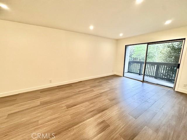 3601 W Hidden Ln Unit 309, Rolling Hills Estates, CA 90274 - empty room featuring wood finished floors and recessed lighting
