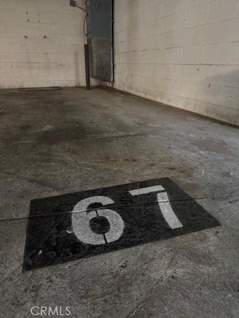 garage with concrete block wall