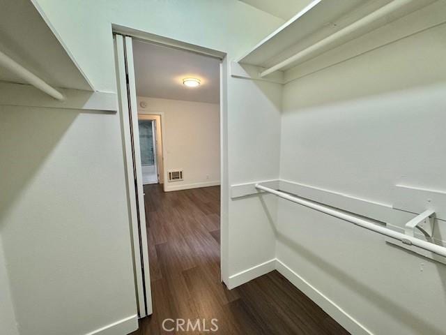 3601 W Hidden Ln Unit 309, Rolling Hills Estates, CA 90274 - walk in closet featuring dark wood finished floors