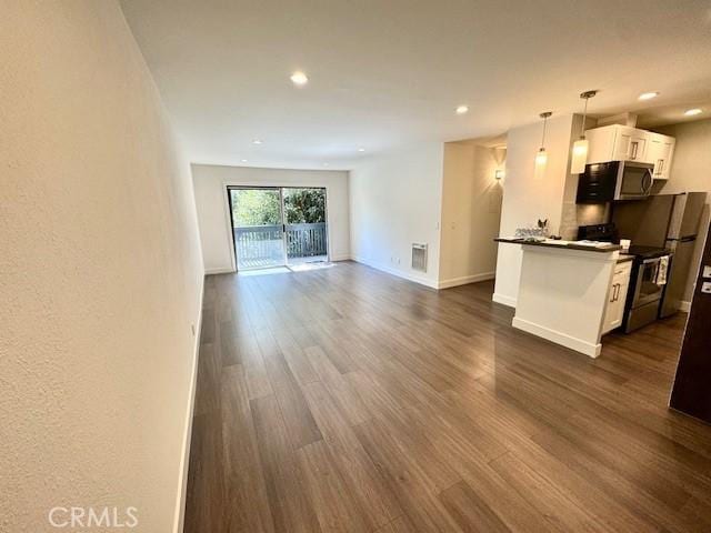 3601 W Hidden Ln Unit 309, Rolling Hills Estates, CA 90274 - unfurnished living room with dark wood-type flooring and recessed lighting