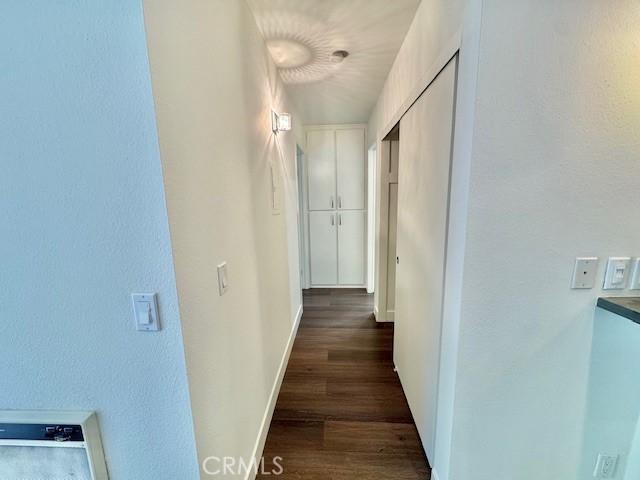 3601 W Hidden Ln Unit 309, Rolling Hills Estates, CA 90274 - corridor with dark wood-type flooring and baseboards