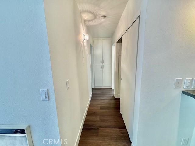 3601 W Hidden Ln Unit 309, Rolling Hills Estates, CA 90274 - corridor with dark wood finished floors and baseboards