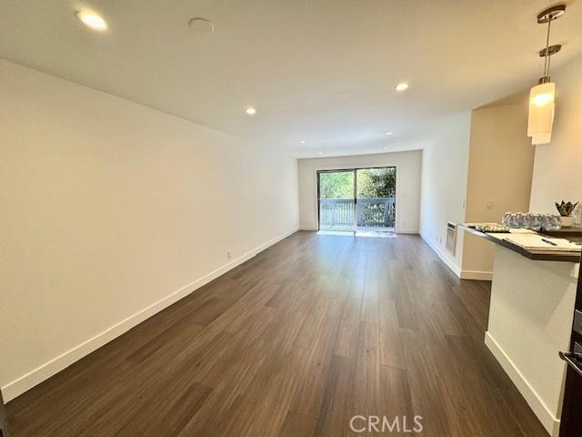 3601 W Hidden Ln Unit 309, Rolling Hills Estates, CA 90274 - unfurnished living room with dark wood-type flooring and recessed lighting