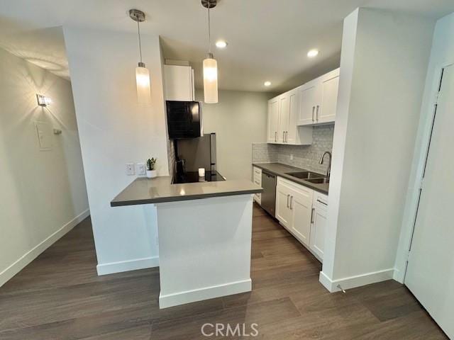 3601 W Hidden Ln Unit 309, Rolling Hills Estates, CA 90274 - kitchen with appliances with stainless steel finishes, dark wood-style floors, tasteful backsplash, and recessed lighting