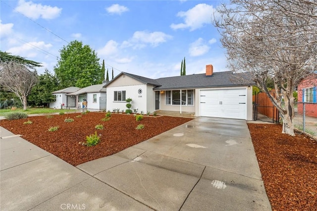 ranch-style home featuring a garage, concrete driveway, a chimney, fence, and stucco siding