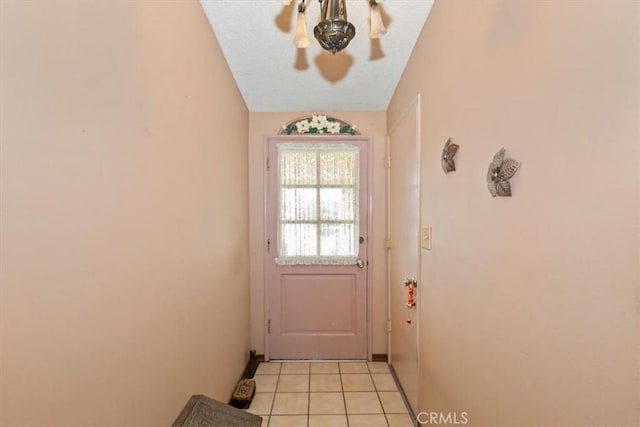 doorway to outside featuring light tile patterned floors