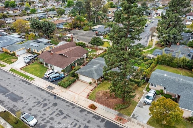 birds eye view of property with a residential view