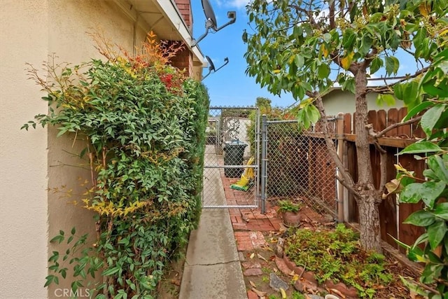 view of yard featuring fence and a gate