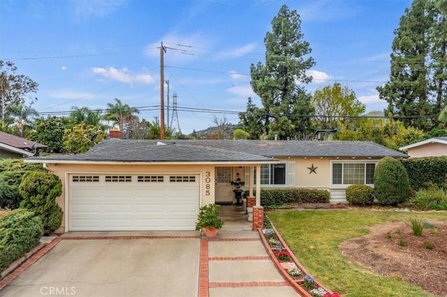 ranch-style home featuring a front lawn, a garage, driveway, and stucco siding