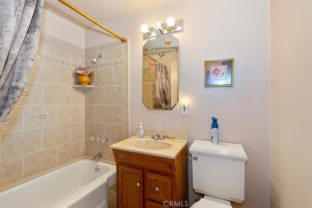 bathroom with vanity, toilet, and shower / tub combination