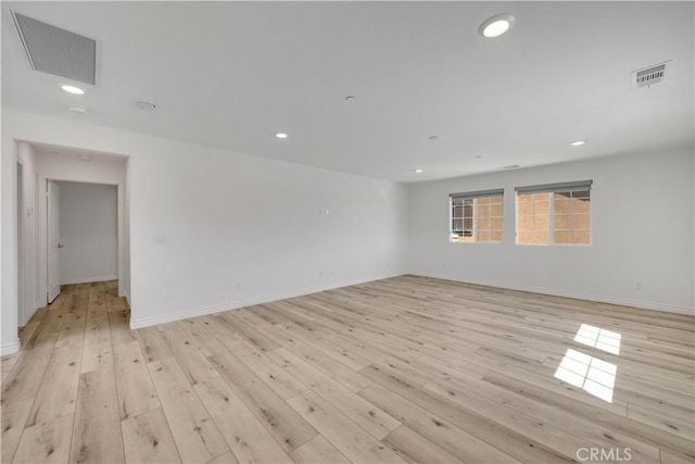 spare room featuring recessed lighting, visible vents, and light wood-style flooring