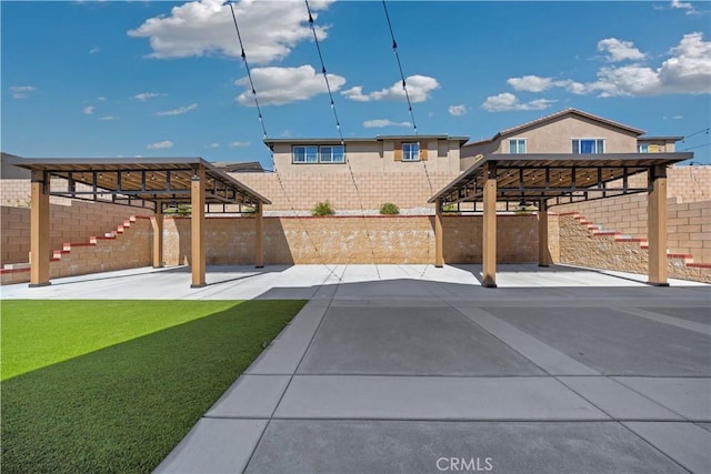 view of patio / terrace with a fenced backyard and stairs