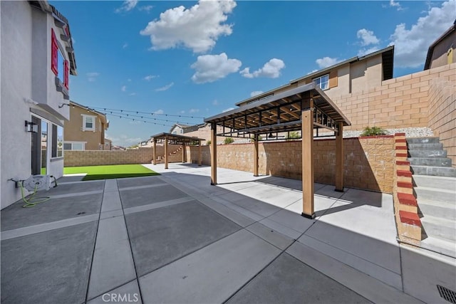 view of patio / terrace featuring a fenced backyard and a gazebo