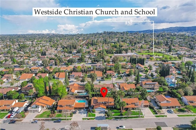 bird's eye view featuring a residential view and a mountain view