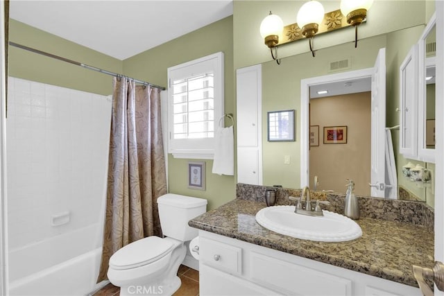 full bathroom with visible vents, toilet, shower / bath combo, vanity, and tile patterned flooring