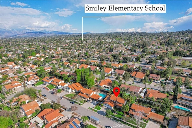 drone / aerial view with a residential view and a mountain view