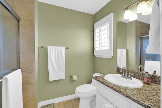 full bath with tile patterned flooring, toilet, vanity, baseboards, and a stall shower