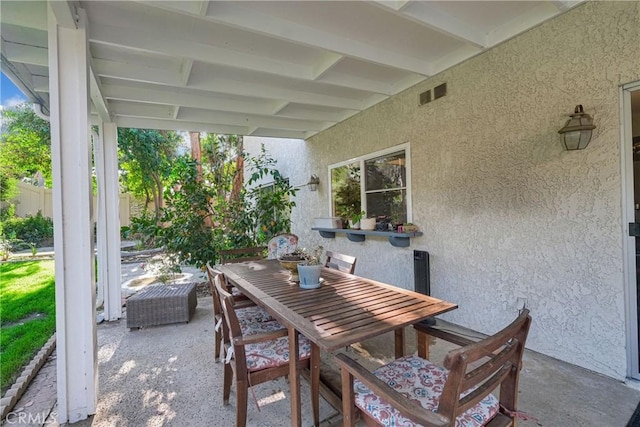 view of patio featuring visible vents and outdoor dining space