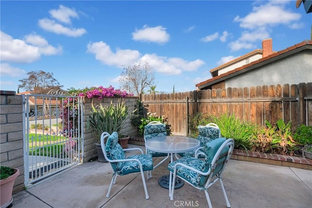 view of patio / terrace featuring outdoor dining space and fence