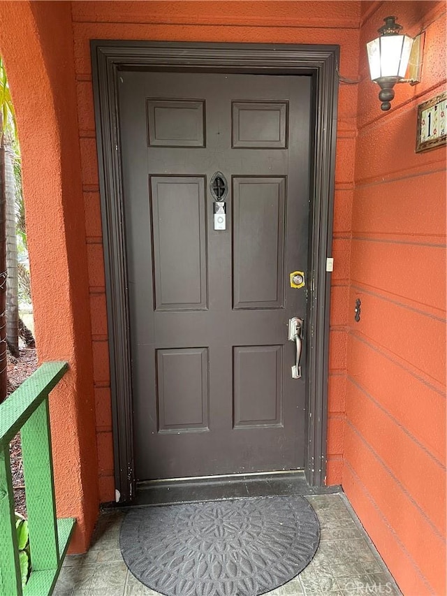 doorway to property with a garage